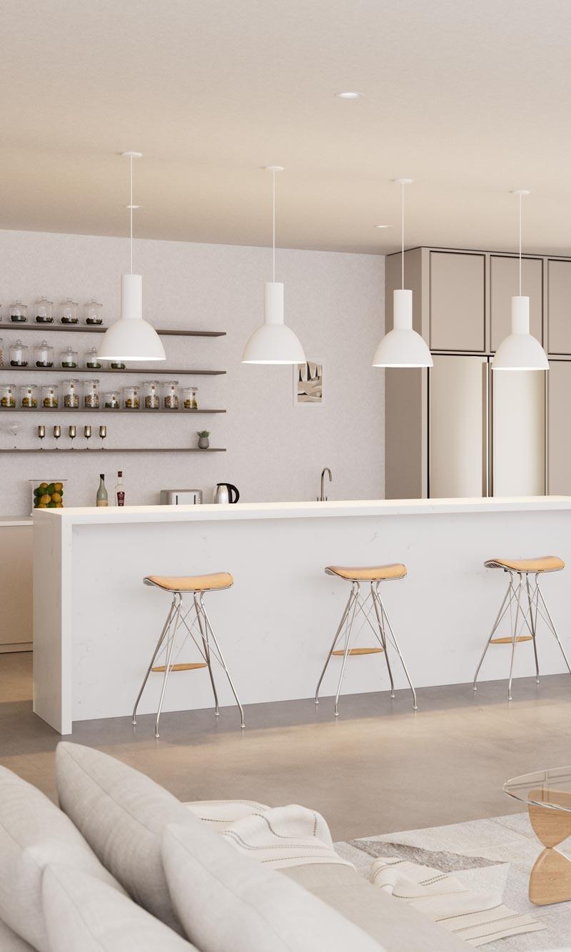 Modern white kitchen island with wooden bar stools and pendant lights.