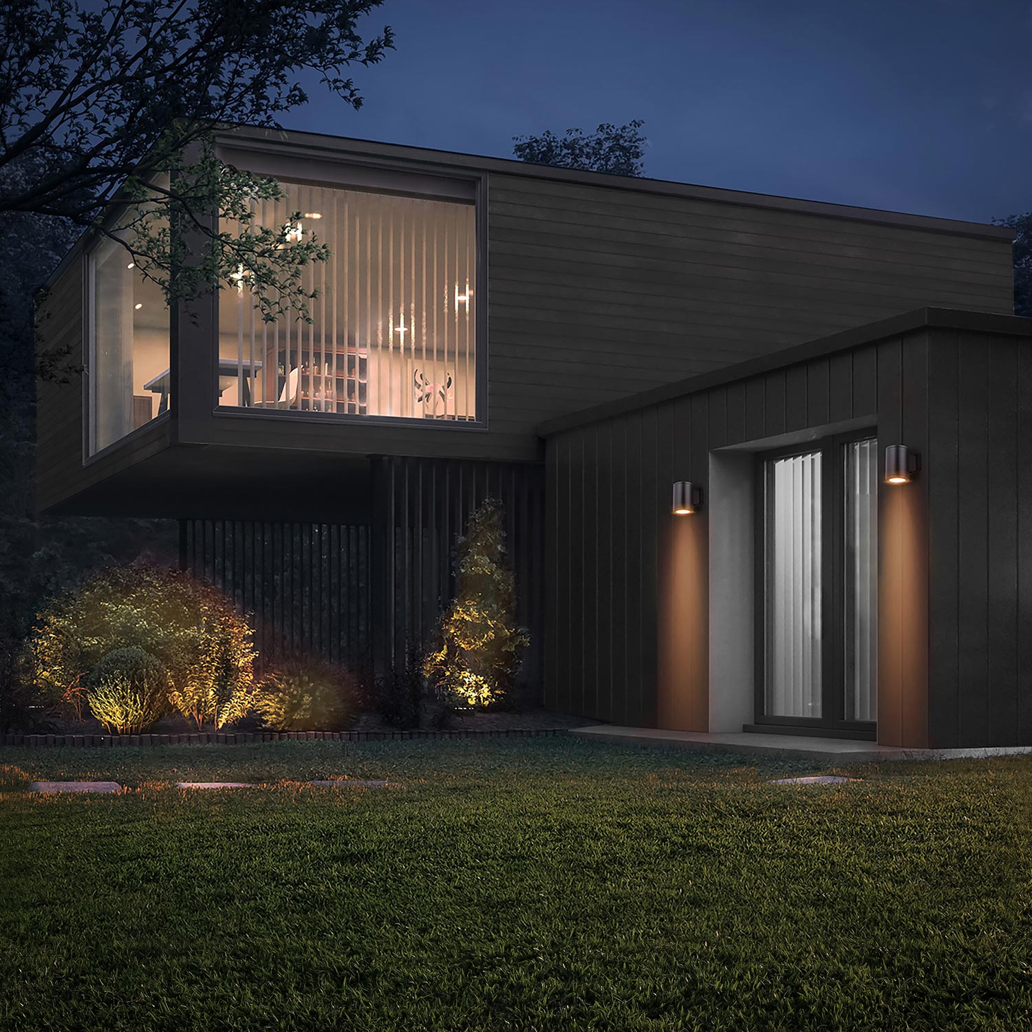 Contemporary dark wood home with exterior wall sconces and illuminated landscaping