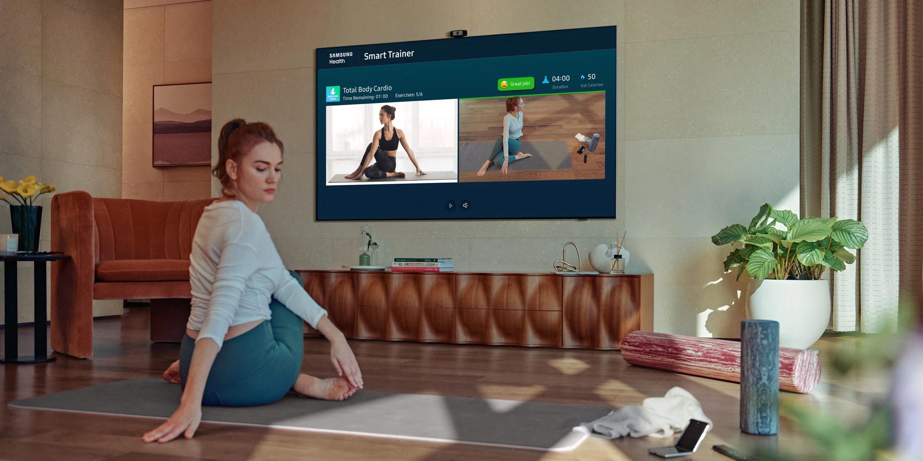 Woman practicing yoga with a Samsung TV